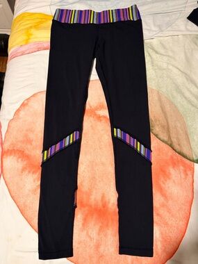 Lululemon leggings with front and back colored stripe and light ruffle.